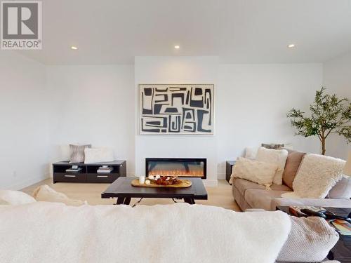 C-304-6900 Burnaby Street, Powell River, BC - Indoor Photo Showing Living Room With Fireplace