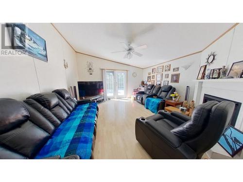 10874 261 Road, Fort St. John, BC - Indoor Photo Showing Living Room With Fireplace