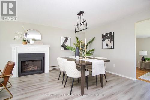 56 The Cove Road, Clarington, ON - Indoor Photo Showing Dining Room With Fireplace