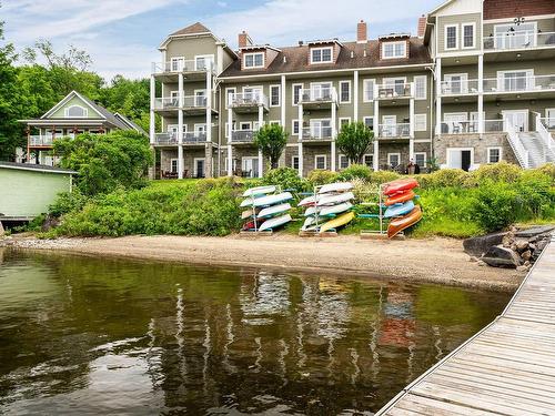 Bord de l'eau - 307-501 Rue Main, Ayer'S Cliff, QC - Outdoor With Body Of Water With Facade