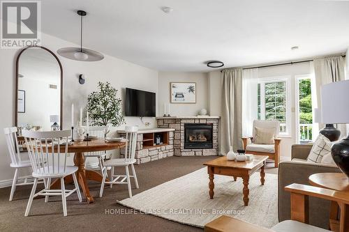 2108-09 - 90 Highland Drive N, Oro-Medonte (Horseshoe Valley), ON - Indoor Photo Showing Living Room With Fireplace