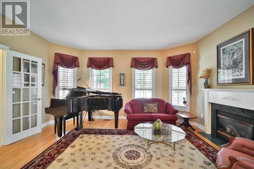 10 Tropicana Gardens, Brampton, ON - Indoor Photo Showing Living Room With Fireplace