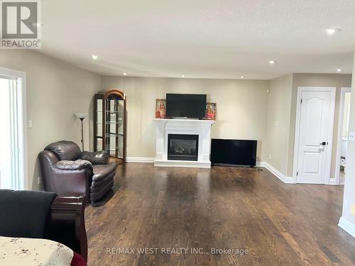 9747 Regional Road, West Lincoln, ON - Indoor Photo Showing Living Room With Fireplace