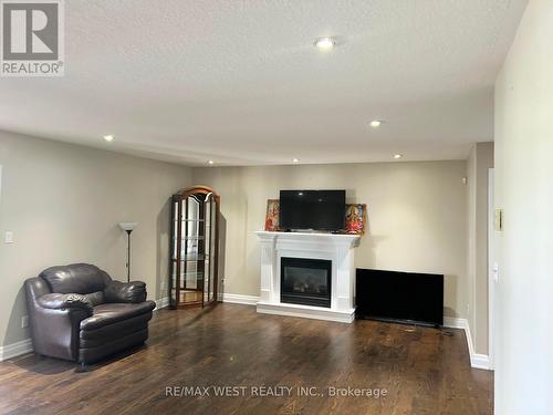 9747 Regional Road, West Lincoln, ON - Indoor Photo Showing Living Room With Fireplace