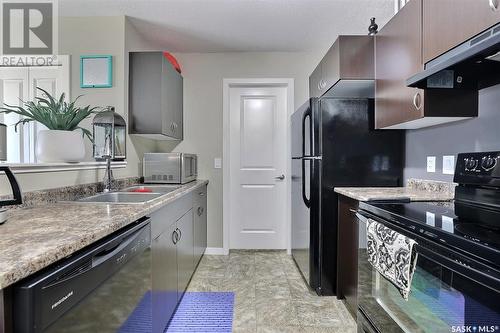173 5079 James Hill Road, Regina, SK - Indoor Photo Showing Kitchen With Double Sink