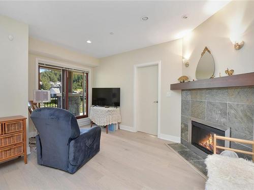 220-1325 Bear Mountain Pkwy, Langford, BC - Indoor Photo Showing Living Room With Fireplace