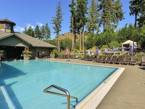 220-1325 Bear Mountain Pkwy, Langford, BC - Outdoor With In Ground Pool With Backyard