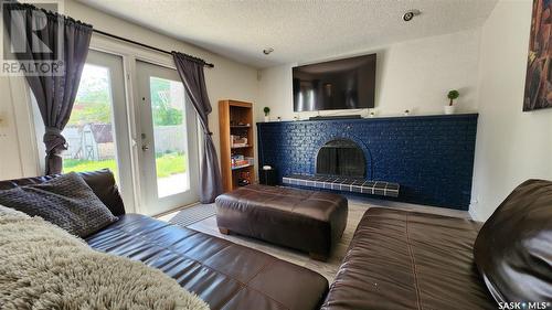 456 Habkirk Drive, Regina, SK - Indoor Photo Showing Living Room With Fireplace