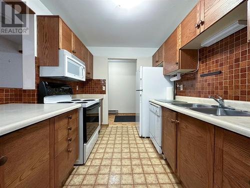 1075 Bernard Avenue Unit# 312, Kelowna, BC - Indoor Photo Showing Kitchen With Double Sink