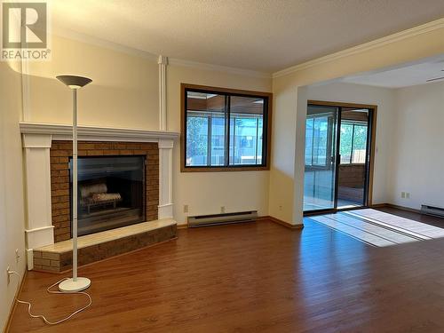 1075 Bernard Avenue Unit# 312, Kelowna, BC - Indoor Photo Showing Other Room With Fireplace