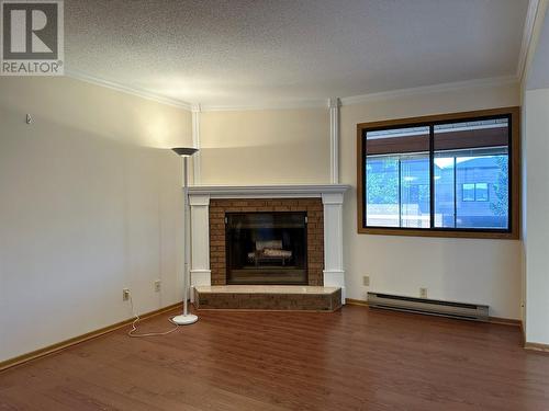 1075 Bernard Avenue Unit# 312, Kelowna, BC - Indoor Photo Showing Living Room With Fireplace