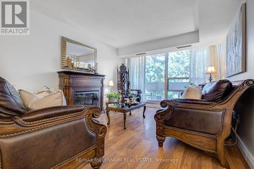 308 - 1300 Marlborough Court, Oakville (College Park), ON - Indoor Photo Showing Living Room With Fireplace