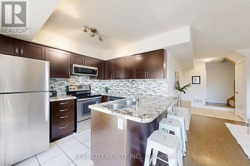 512 - 142 Widdicombe Hill Boulevard, Toronto, ON - Indoor Photo Showing Kitchen With Double Sink With Upgraded Kitchen