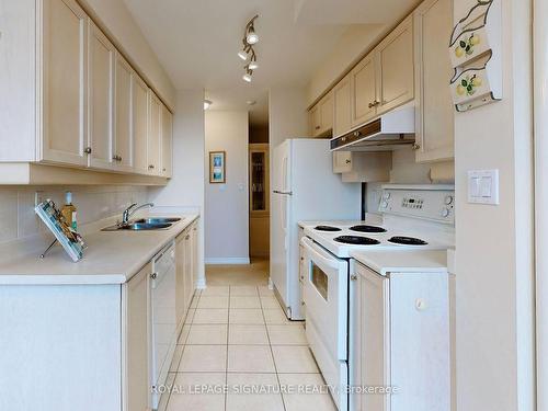 401-2 Rean Dr, Toronto, ON - Indoor Photo Showing Kitchen With Double Sink