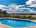 Piscine - 1107-7680 Boul. Marie-Victorin, Brossard, QC  - Outdoor With In Ground Pool With View 