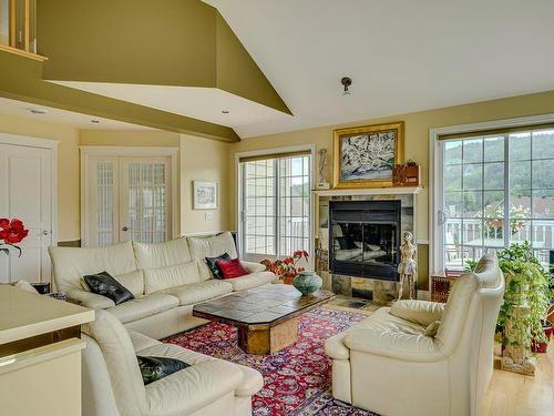 Living room - 165 Ch. Louis-Dufour, Saint-Sauveur, QC - Indoor Photo Showing Living Room With Fireplace