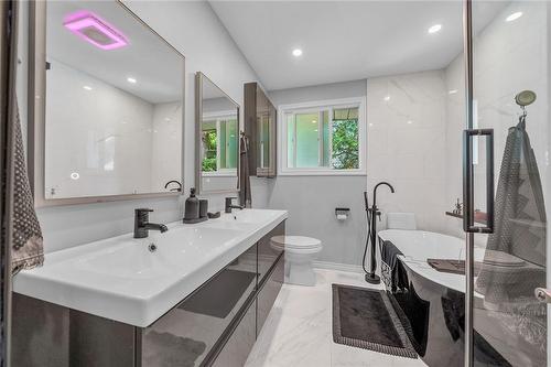 bathroom with double sink, pot lights, heated floors, separate glass shower - 58 Graystone Drive, Hamilton, ON - Indoor Photo Showing Bathroom