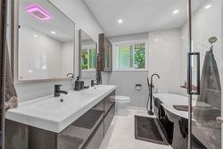 bathroom with double sink, pot lights, heated floors, separate glass shower - 