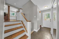 foyer and staircase to upper and lower levels. - 