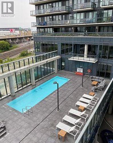 602 - 49 East Liberty Street, Toronto (Niagara), ON - Outdoor With In Ground Pool With Balcony