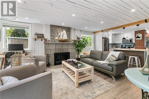 28 School Lane, Shediac Cape, NB - Indoor Photo Showing Living Room With Fireplace