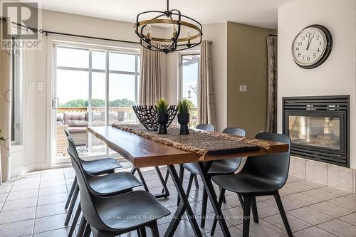 44 Jenny Court, Hamilton (Stoney Creek), ON - Indoor Photo Showing Dining Room With Fireplace