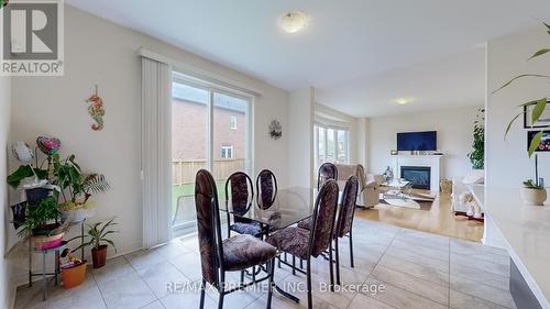 288 Elbern Markell Drive, Brampton, ON - Indoor Photo Showing Dining Room With Fireplace