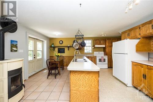 Eat in kitchen with Pellett stove - 2091 Scotch Corners Road, Carleton Place, ON - Indoor Photo Showing Kitchen With Double Sink