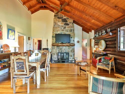 Vue d'ensemble - 477 Ch. Des Critiques, Montebello, QC - Indoor Photo Showing Dining Room With Fireplace