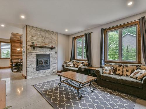 Living room - 180 Av. Nantel, Sainte-Agathe-Des-Monts, QC - Indoor Photo Showing Living Room With Fireplace