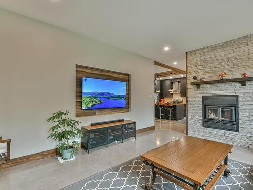 Living room - 180 Av. Nantel, Sainte-Agathe-Des-Monts, QC - Indoor Photo Showing Living Room With Fireplace