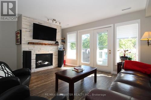 26 - 48 Ontario Street S, Lambton Shores (Grand Bend), ON - Indoor Photo Showing Living Room With Fireplace