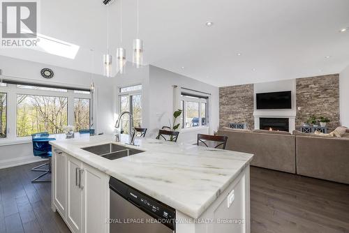 17 Ontario Street, Halton Hills, ON - Indoor Photo Showing Kitchen With Fireplace With Double Sink