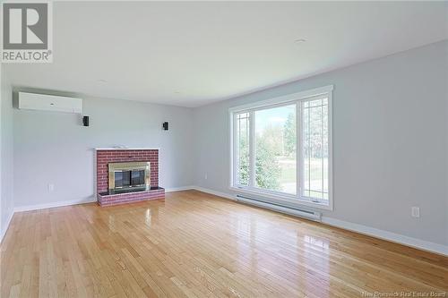 298 Route 105, Maugerville, NB - Indoor Photo Showing Living Room With Fireplace