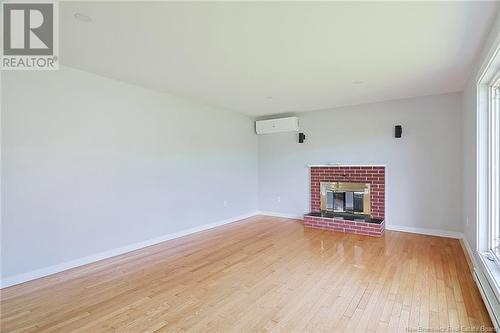 298 Route 105, Maugerville, NB - Indoor Photo Showing Living Room With Fireplace