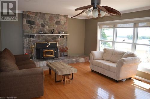 77 Rockview Road, Callander, ON - Indoor Photo Showing Living Room With Fireplace