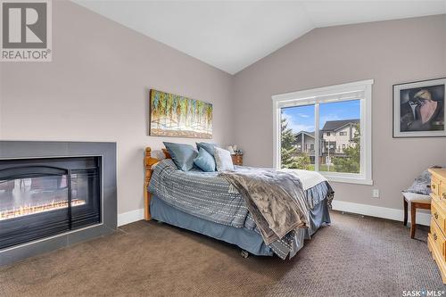 114 Johns Road, Saskatoon, SK - Indoor Photo Showing Bedroom With Fireplace
