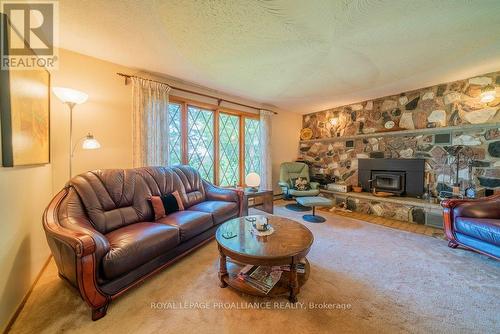 17100 Highway 41, Addington Highlands, ON - Indoor Photo Showing Living Room With Fireplace