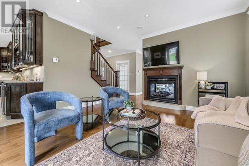 24 Atlantica Drive, Paradise, NL - Indoor Photo Showing Living Room With Fireplace