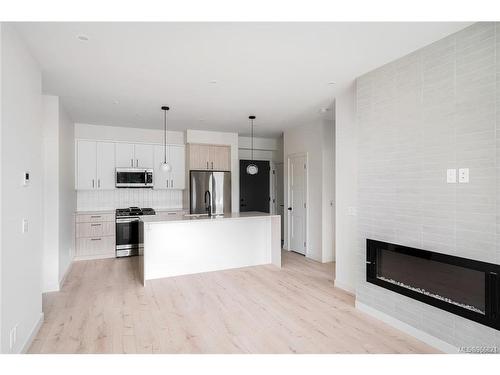 508-947 Whirlaway Cres, Langford, BC - Indoor Photo Showing Kitchen With Fireplace With Stainless Steel Kitchen With Upgraded Kitchen