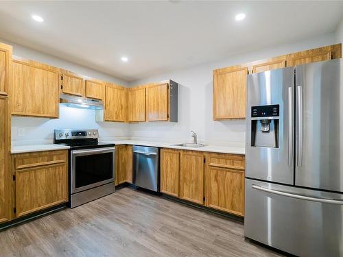 205-3108 Barons Rd, Nanaimo, BC - Indoor Photo Showing Kitchen With Stainless Steel Kitchen