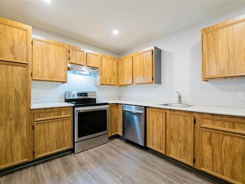 205-3108 Barons Rd, Nanaimo, BC - Indoor Photo Showing Kitchen With Stainless Steel Kitchen