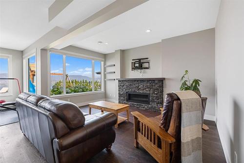 5590 Trestle Ridge Court, Kelowna, BC - Indoor Photo Showing Living Room With Fireplace