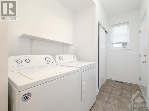 Main floor laundry with mudroom and entry to 2-car garage - 40 Tom Gavinski Street, Arnprior, ON - Indoor Photo Showing Laundry Room