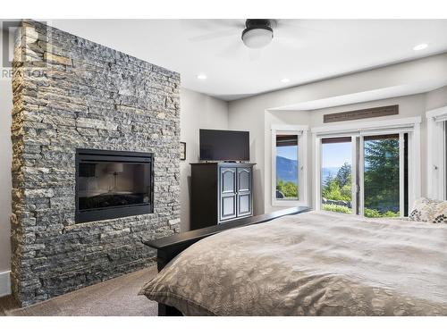 3901 60 Street Nw, Salmon Arm, BC - Indoor Photo Showing Bedroom With Fireplace