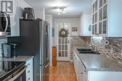 239 Southwind Court, Lambton Shores (Grand Bend), ON - Indoor Photo Showing Kitchen With Double Sink With Upgraded Kitchen