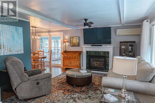 239 Southwind Court, Lambton Shores (Grand Bend), ON - Indoor Photo Showing Living Room With Fireplace