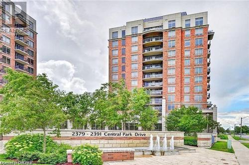 606 - 2391 Central Park Drive, Oakville, ON - Outdoor With Balcony With Facade