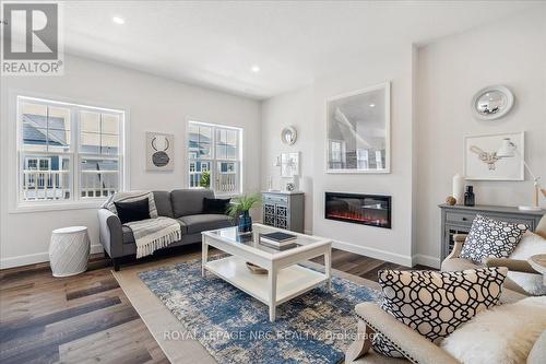 8B Shores Lane, Fort Erie, ON - Indoor Photo Showing Living Room With Fireplace