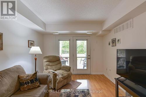 112 - 50 Mulligan Lane, Wasaga Beach, ON - Indoor Photo Showing Living Room With Fireplace